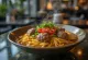 Bakso s nudlemi, podávané s bohatými masovými kuličkami, čerstvým koriandrem a chilli